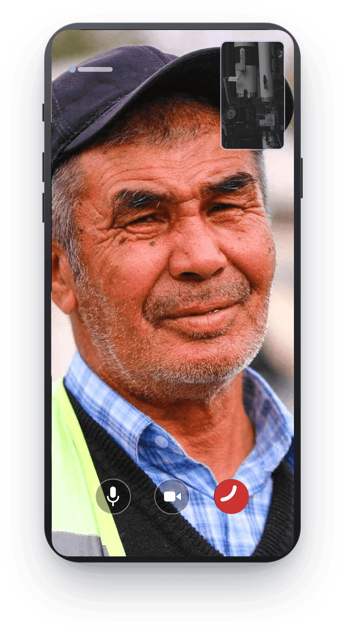 A video call in progress on a phone: a certified operator on screen, with the member's own camera on the equipment in the corner