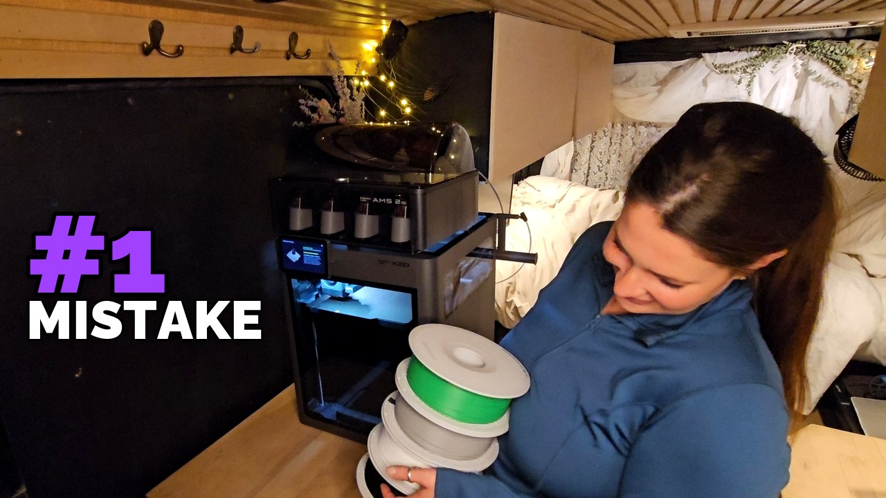 Kelsey holding a stack of filament spools beside a Bambu Lab 3D printer, with the hook “#1 MISTAKE” on the van door